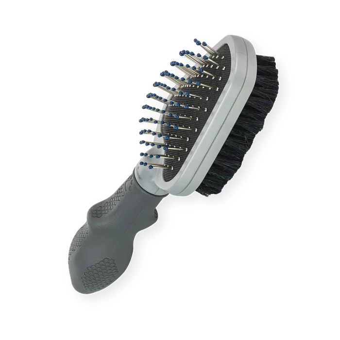 FURminator Dual Grooming Brush showing the metal bristle side