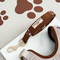 Cow-patterned dog leash by Cocopup London with brown and white spots and metal clasp.