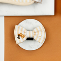 Pale yellow and white striped Dog Bow Tie with bee and honeycomb embroidered decals.