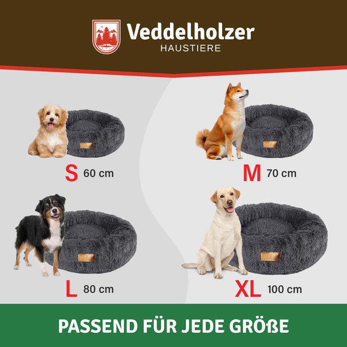Größenübersicht mit vier Hunden am dunkelgrauen Bett: S 60 cm, M 70 cm, L 80 cm und XL 100 cm