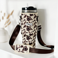 Cocopup London Stanley Quencher 40oz with ivory patterned carry case next to a white vase of dried grass.
