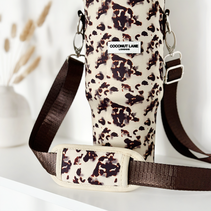 Ivory tortoiseshell-patterned tumbler carry case by Cocopup London on a white surface.