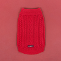 Cable knit dog jumper in mulled wine red, displayed on a matching red background.