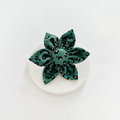 Khaki leopard-print collar flower by Cocopup London on a plain round white surface.