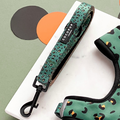 Khaki leopard print dog lead with black clasp and padded handle, Cocopup London branding.