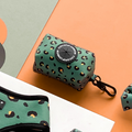 Khaki leopard print neoprene poop bag holder by Cocopup London with black clip, set against a multicolored background.