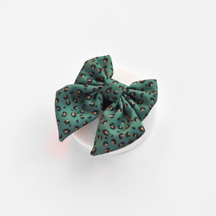 Khaki sailor bow tie with green leopard print pattern displayed on a white background.