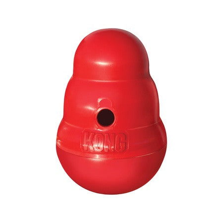 KONG Wobbler standing upright on a wooden floor
