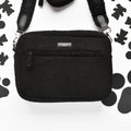 Large fuzzy brown Cocopup London dog walking bag with front zip pocket and built-in poop bag dispenser.
