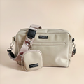 Large caramel brown dog walking bag with matching pouch, detachable strap, and Harold the Highland Cow design.