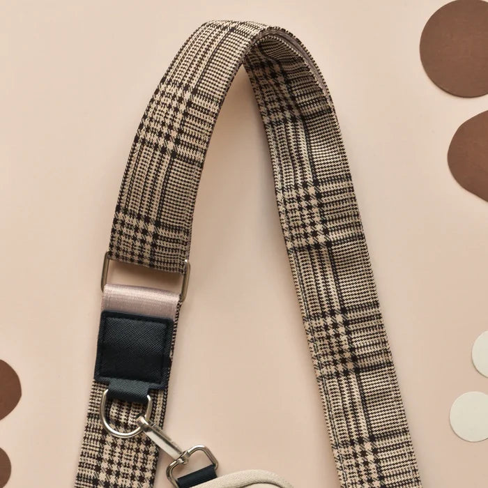 Large Pup Plaid caramel latte dog walking bag with beige and black strap and silver metal hardware.