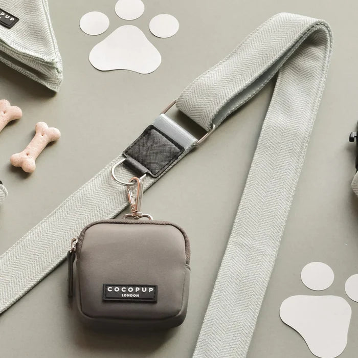 Cocopup London large mocha dog walking bag in sage tweed, with treats, dispenser, and leash on a light background.
