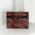 Leopard Pup Card Holder by Cocopup London in brown vegan leather with a leopard pattern, gold accents, and stripe detail.