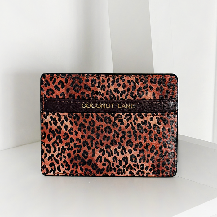 Leopard Pup Card Holder by Cocopup London in brown vegan leather with a leopard pattern, gold accents, and stripe detail.