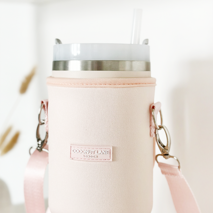 Marshmallow pink tumbler carry case with straw, adjustable cross-body strap, and Cocopup London branded holder.
