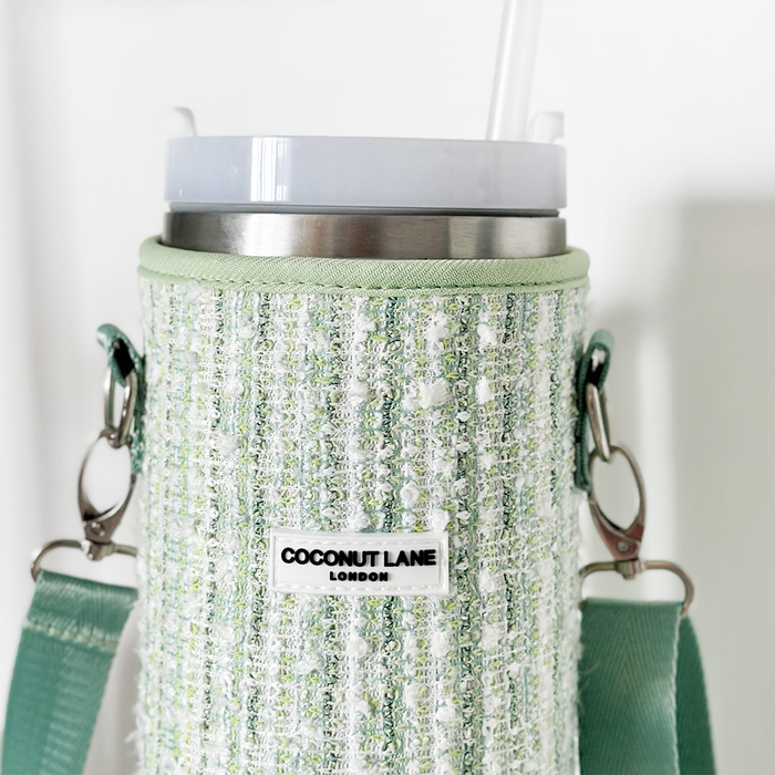 Matcha green textured tweed tumbler carry case with a strap, designed to hold a cup and straw.