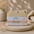 Bar of soap with 'OldSoul Soap Company' packaging on a neutral background