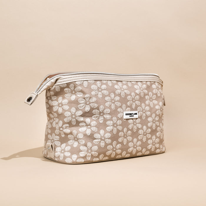 Mocha Flower Expandable Makeup Bag by Cocopup London in brown floral print, displayed on a beige background.