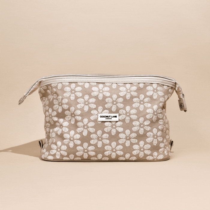 Mocha floral expandable makeup bag with Coconut Lane label, displayed on a neutral background.