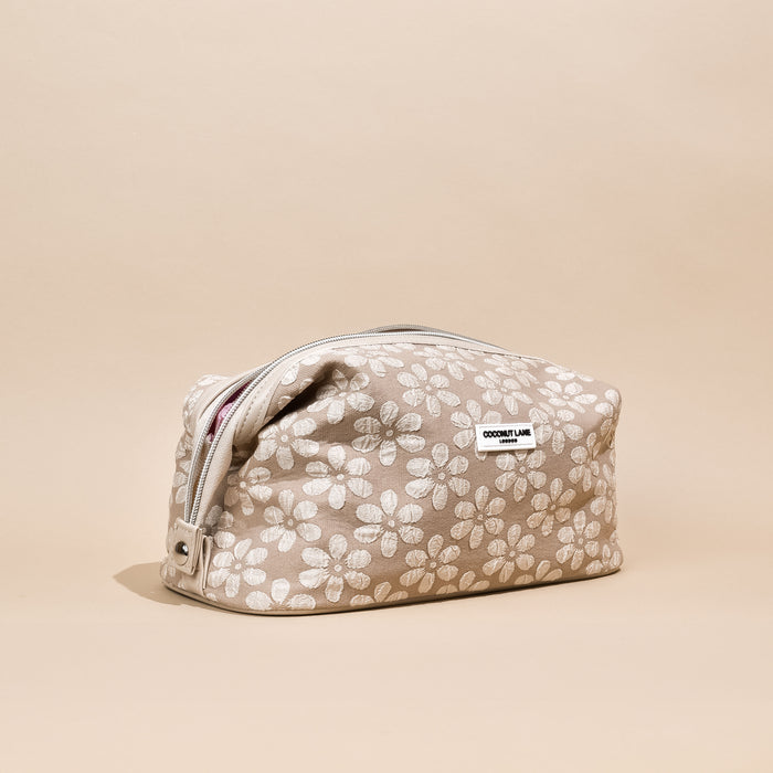Expandable makeup bag in mocha brown with floral pattern, Cocopup London branding on the front.