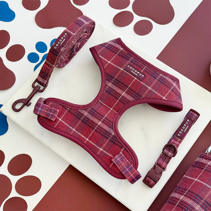 Mulberry plaid harness, lead, and collar set by Cocopup London on a marble board with paw print details.