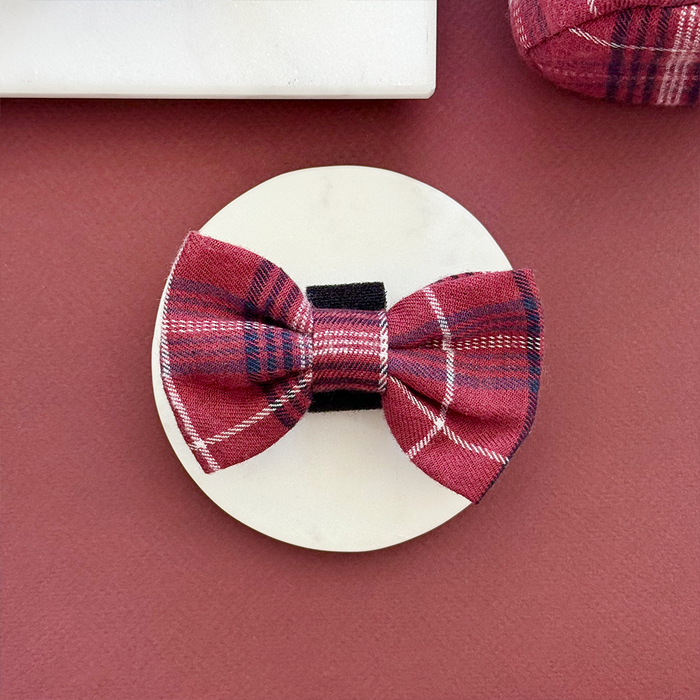 Mulberry plaid dog bow tie on a round card with black and white stripes, Cocopup London branding visible.