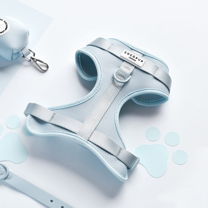 Pink NAKD Adjustable Neck Harness by Cocopup London with blue paw print patterns, displayed on a white background.