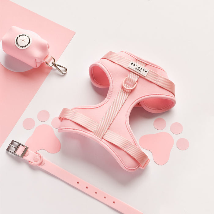 Pink Cocopup London NAKD Adjustable Neck Harness with pink paw prints on a white background and pink backdrop.