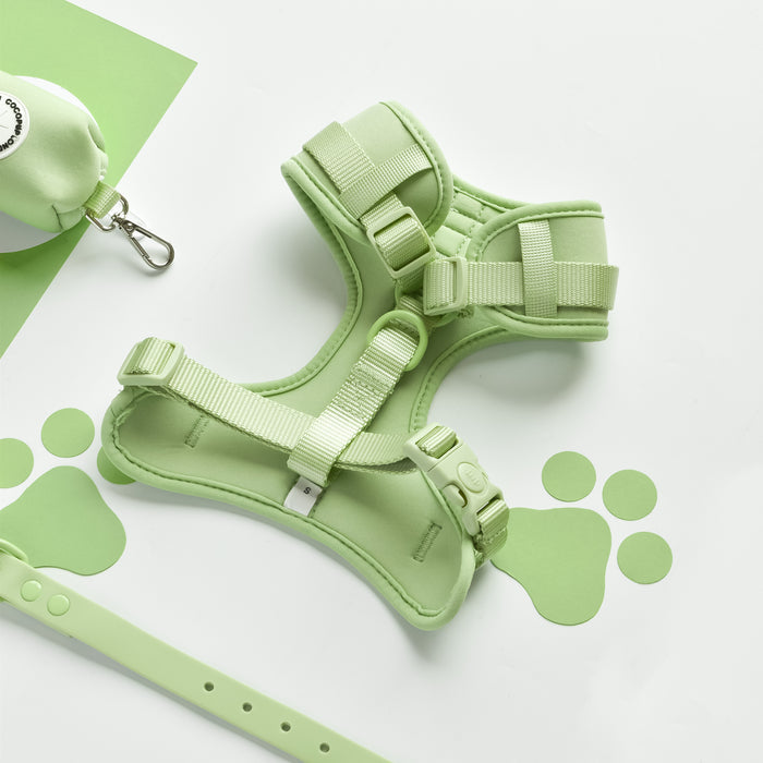 Light green Cocopup London adjustable dog harness in Matcha, shown with matching leash and waste bag dispenser.