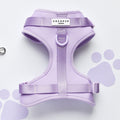Parma Violets NAKD adjustable neck harness with purple paw prints on white, by Cocopup London.
