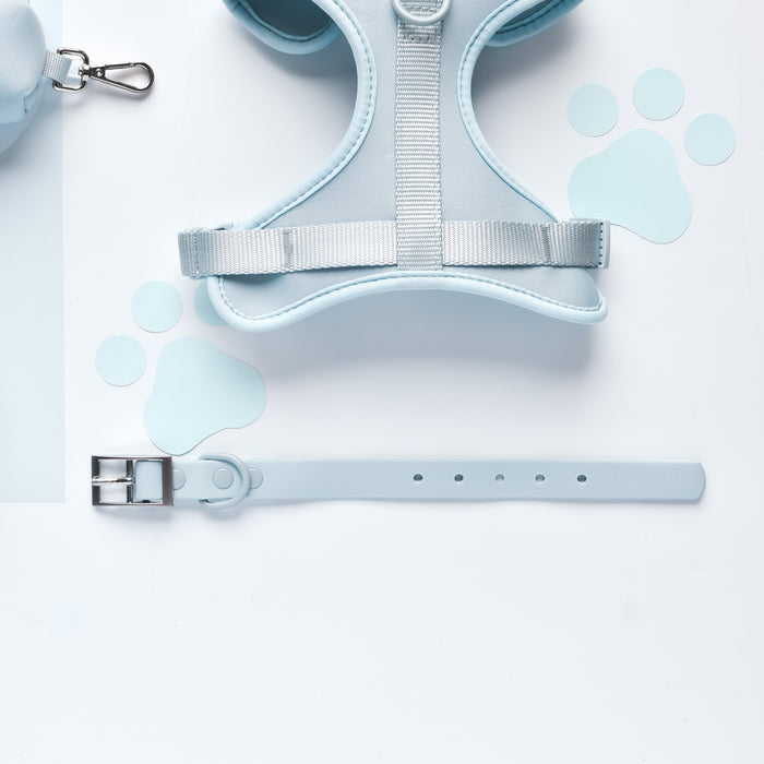 Pink Cocopup London harness, lead, collar and poop bag holder set with light blue paw prints on white background.