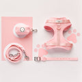 Light pink Cocopup London NAKD Candyfloss harness, lead, collar, and poop bag holder on paw print background.