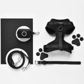 Black Cocopup London harness, lead, collar, and poop bag holder displayed on a light background with paw print pattern.