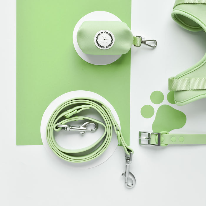 Cocopup London NAKD Matcha set including green adjustable harness, lead, collar, and poop bag holder on white background.