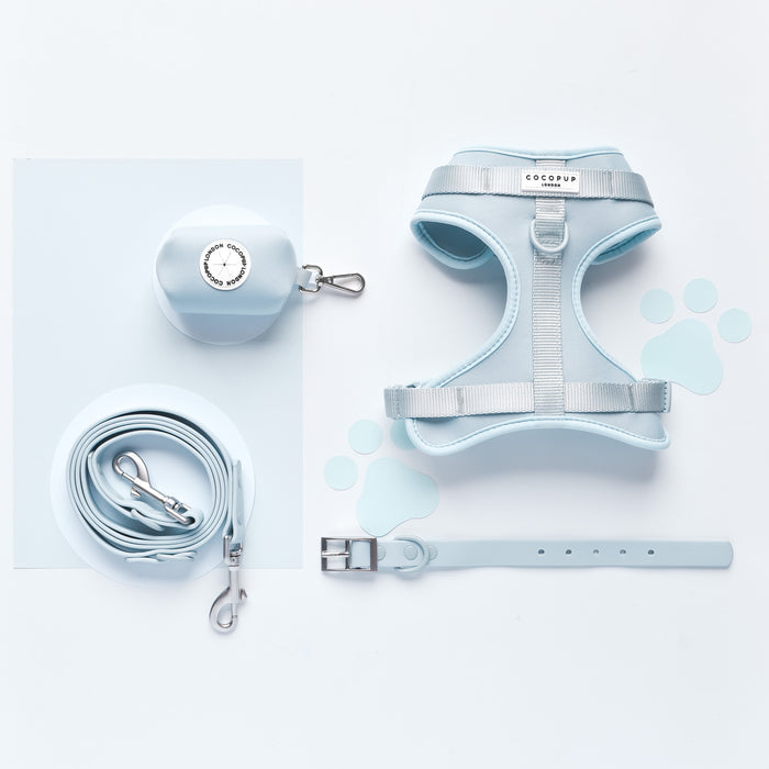 Light blue NAKD poop bag holder with a smooth finish and black zip, featuring Cocopup London branding.