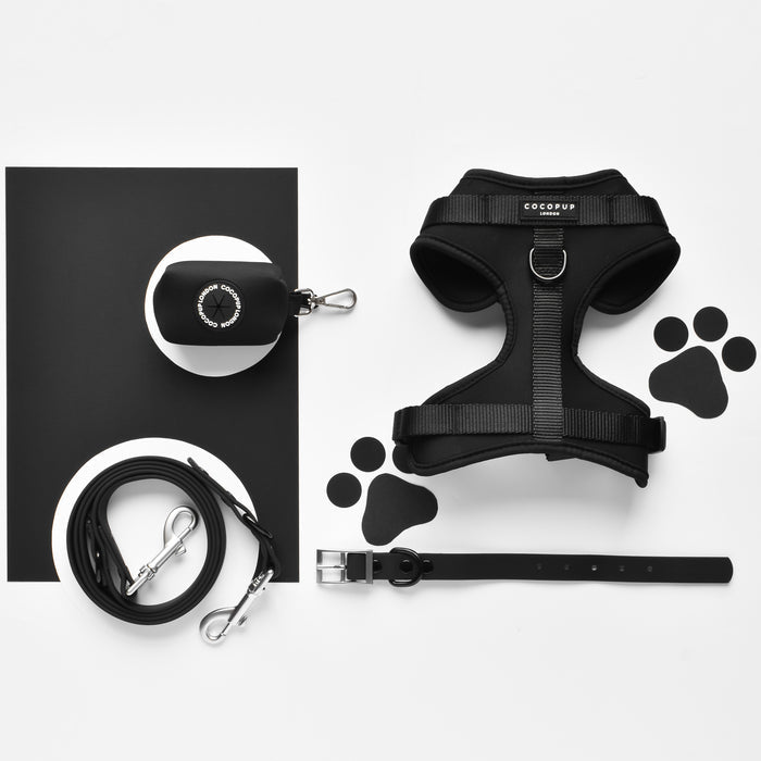 Black Cocopup London NAKD poop bag holder with white and black paw print pattern.