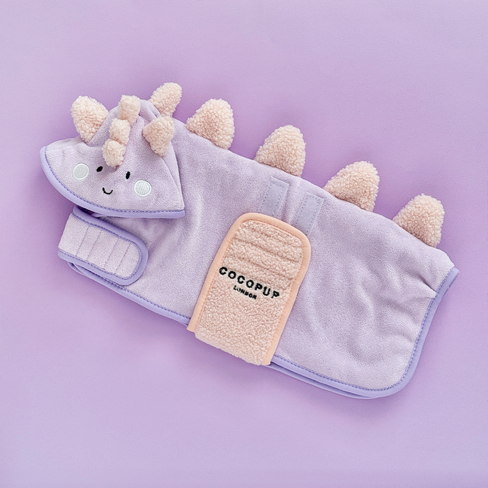 Light purple microfibre dog drying robe with spikes and a playful dinosaur face design.