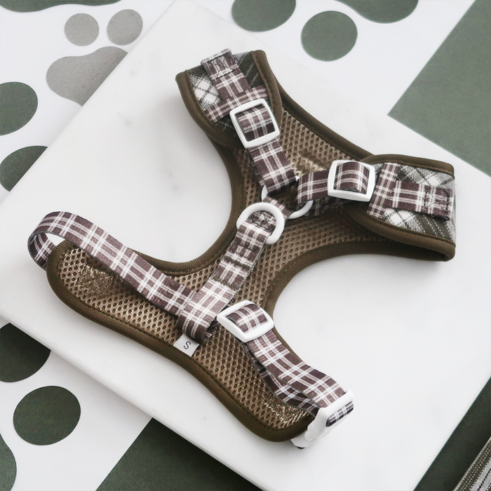 Olive green check dog harness with adjustable neck and black safety lock buckle.