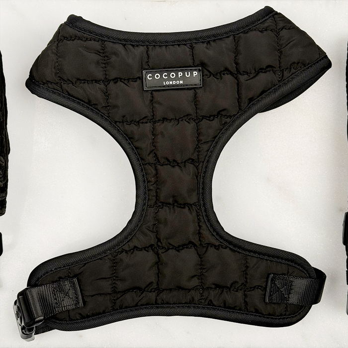 Black quilted dog harness, collar, and lead set with adjustable straps from Cocopup London.