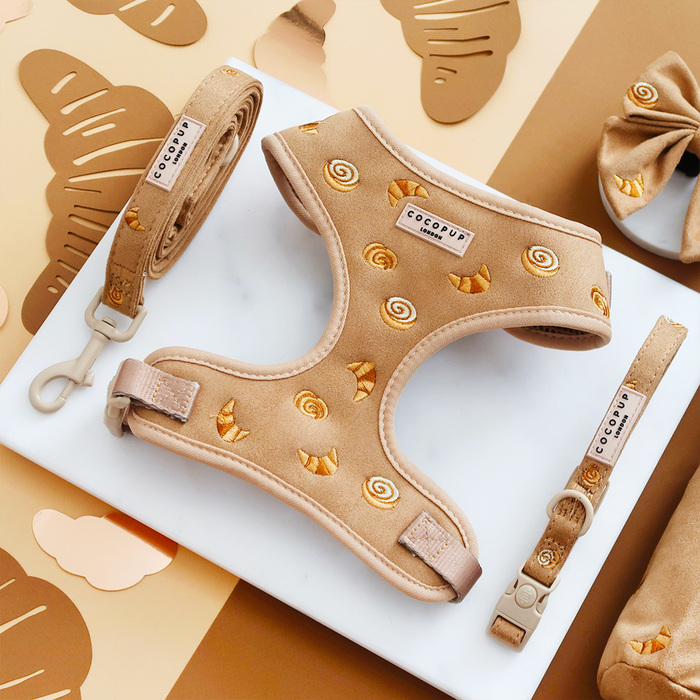 Tan harness, lead, and collar set with croissant and cinnamon roll print from Cocopup London.
