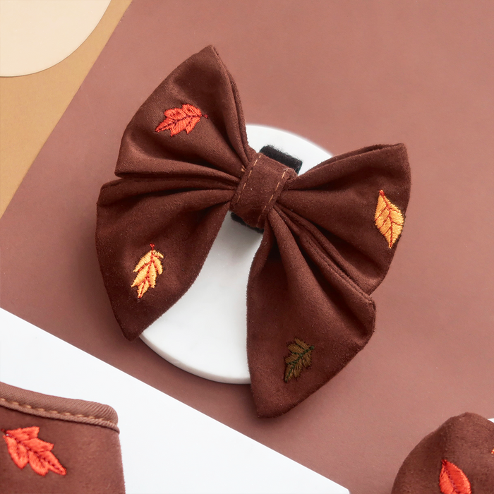Brown sailor bow tie with red, orange, and green embroidered fall leaves by Cocopup London.
