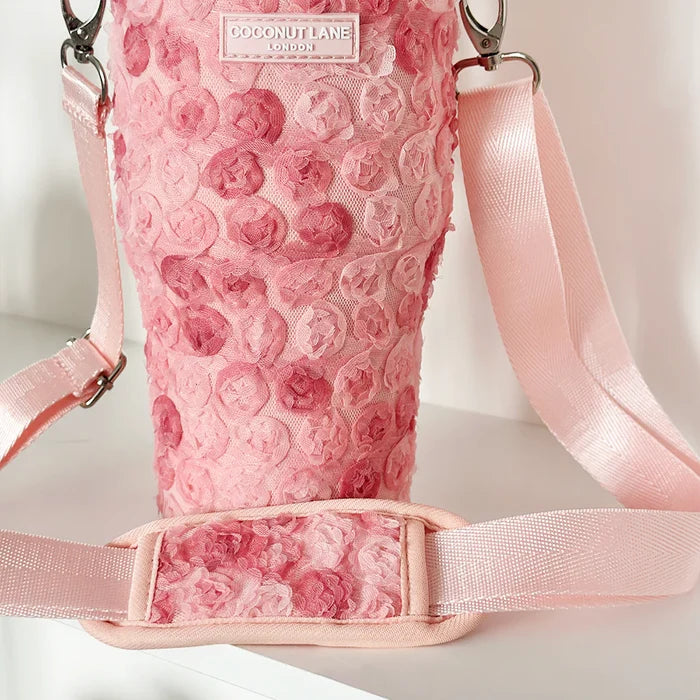 Pink Peony Pup tumbler carry case with rose pattern, textured finish, and a wide strap.