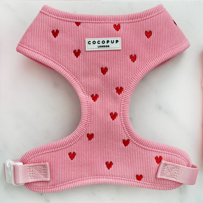 Pink cord dog harness with heart pattern, adjustable neck design by Cocopup London.