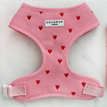 Pink cord dog harness with heart pattern, adjustable neck design by Cocopup London.