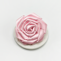 Pink satin rose-shaped collar flower accessory for dogs by Cocopup London.