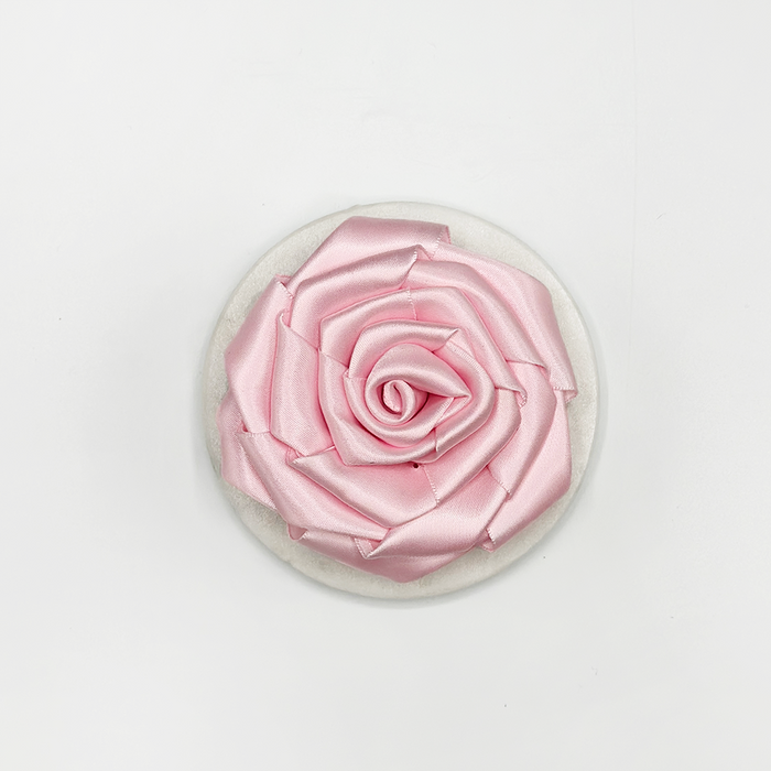 Light pink Cocopup London collar flower accessory with layered petals, designed to attach to a dog’s collar.
