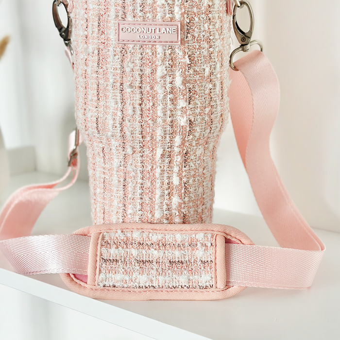 Pink textured tweed tumbler carry case with wide strap and Cocopup London label.