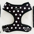 Polka dot adjustable neck harness by Cocopup London in black and white, displayed on a plain white background.