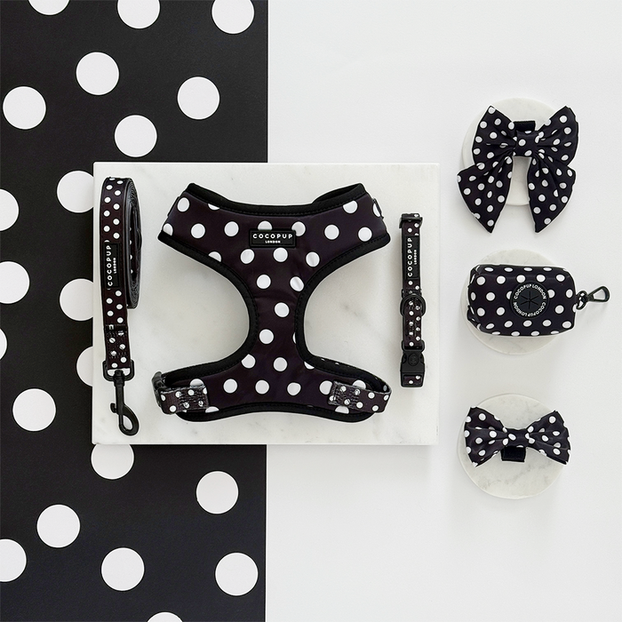 Black and white polka dot adjustable dog harness with Cocopup London branding.