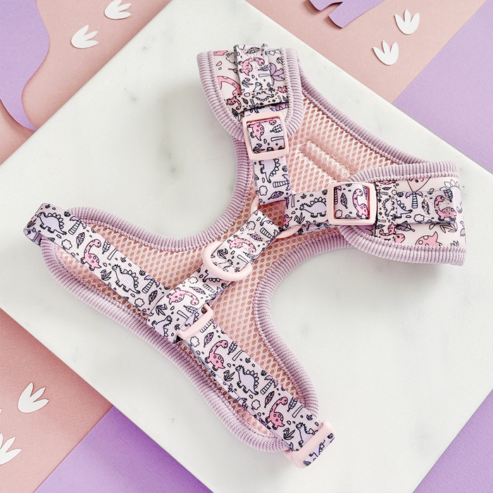 Pastel pink and purple Princess Dino adjustable neck harness by Cocopup London on a white and pink background.